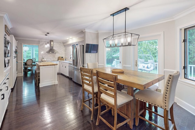 3 Inwood Ln, Woodbury, CT 06798 - dining space featuring plenty of natural light, a chandelier, dark wood-style floors, and crown molding