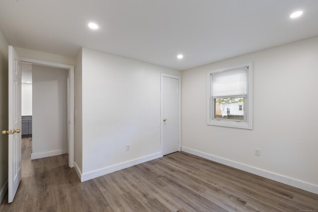53 Kalish Ave, Enfield, CT 06082 - spare room featuring wood finished floors, baseboards, and recessed lighting