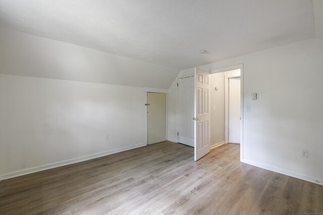 53 Kalish Ave, Enfield, CT 06082 - bonus room featuring vaulted ceiling, wood finished floors, and baseboards