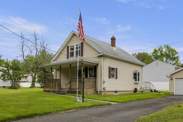 49 First Ave, Enfield, CT 06082 - view of front of property featuring covered porch, a chimney, and a front yard