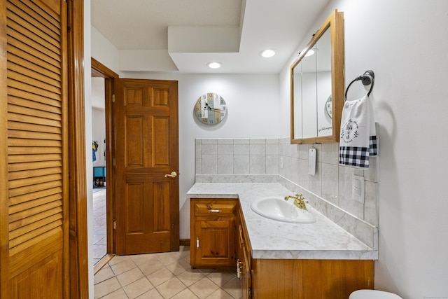 49 First Ave, Enfield, CT 06082 - bathroom with tile patterned flooring, vanity, tasteful backsplash, a closet, and recessed lighting