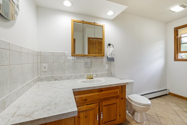 49 First Ave, Enfield, CT 06082 - bathroom with baseboard heating, toilet, vanity, tile patterned flooring, and backsplash