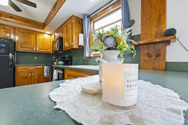 49 First Ave, Enfield, CT 06082 - kitchen with freestanding refrigerator, brown cabinetry, range with electric stovetop, and ceiling fan