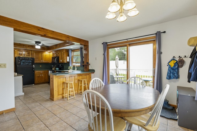 49 First Ave, Enfield, CT 06082 - dining area with a chandelier, light tile patterned flooring, and baseboards
