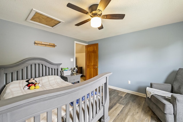 49 First Ave, Enfield, CT 06082 - bedroom featuring wood finished floors, attic access, ceiling fan, and baseboards