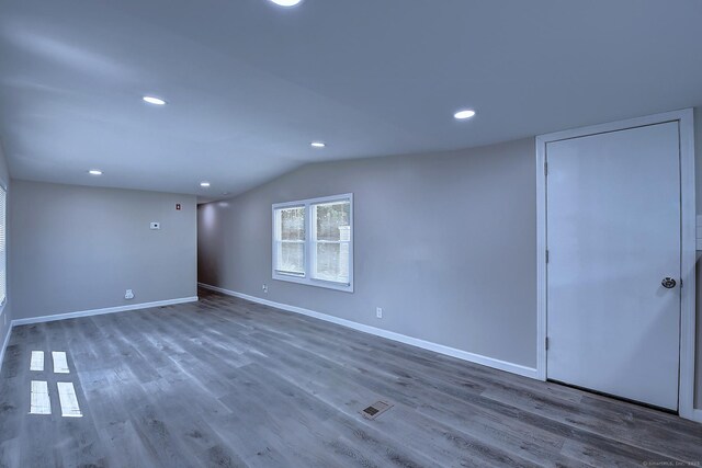 66 Nancy Ln, Naugatuck, CT 06770 - empty room with lofted ceiling, baseboards, wood finished floors, and recessed lighting