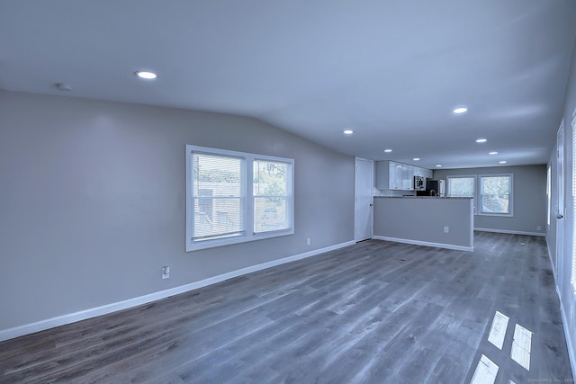 66 Nancy Ln, Naugatuck, CT 06770 - unfurnished living room featuring recessed lighting, vaulted ceiling, baseboards, and dark wood-style flooring