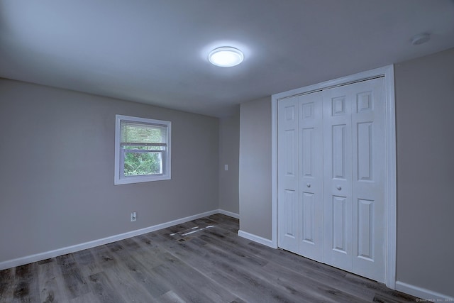 66 Nancy Ln, Naugatuck, CT 06770 - unfurnished bedroom with wood finished floors, baseboards, and a closet