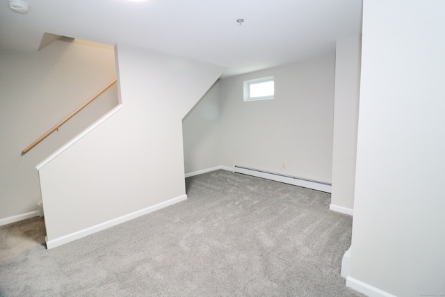 678 Savin Ave Apt 2J, West Haven, CT 06516 - additional living space featuring a baseboard heating unit, carpet flooring, baseboards, and stairway