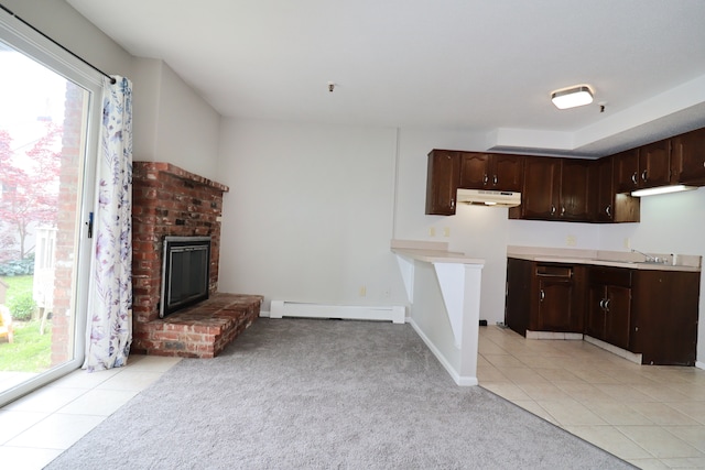 678 Savin Ave Apt 2J, West Haven, CT 06516 - kitchen with a baseboard radiator, plenty of natural light, under cabinet range hood, and dark brown cabinetry