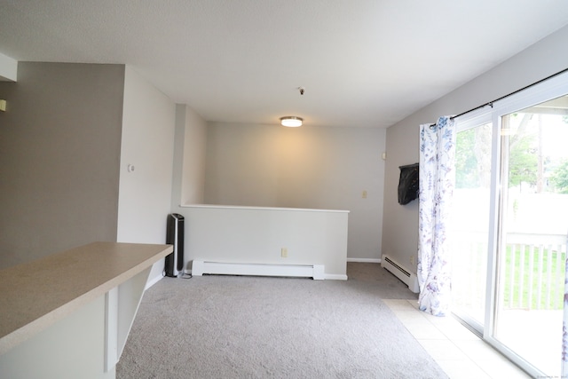 678 Savin Ave Apt 2J, West Haven, CT 06516 - spare room featuring a baseboard radiator, light colored carpet, and baseboards