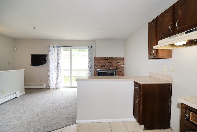 678 Savin Ave Apt 2J, West Haven, CT 06516 - kitchen featuring under cabinet range hood, baseboard heating, open floor plan, light countertops, and a brick fireplace