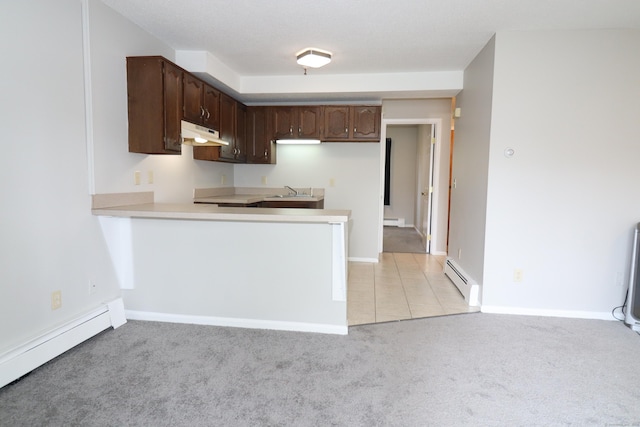 678 Savin Ave Apt 2J, West Haven, CT 06516 - kitchen featuring a baseboard radiator, under cabinet range hood, dark brown cabinetry, and light carpet