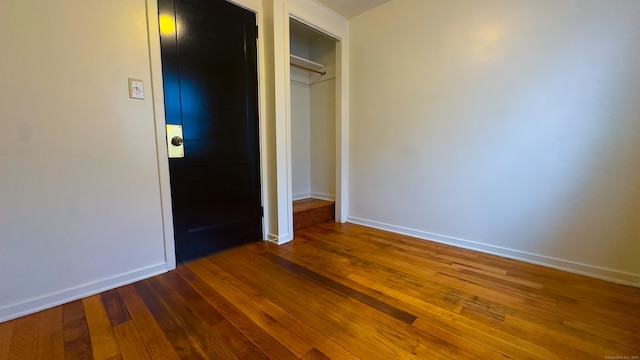 125 Lebanon St, Hartford, CT 06112 - unfurnished bedroom featuring dark wood-style flooring, baseboards, and a closet