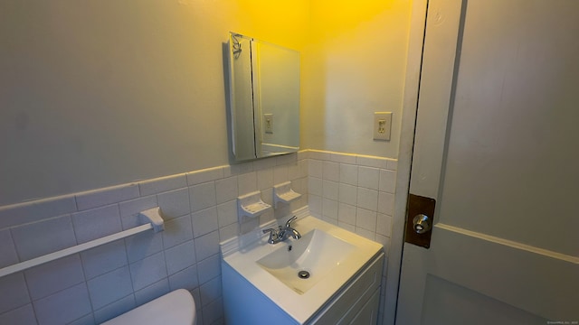 125 Lebanon St, Hartford, CT 06112 - bathroom with toilet, vanity, a wainscoted wall, and tile walls