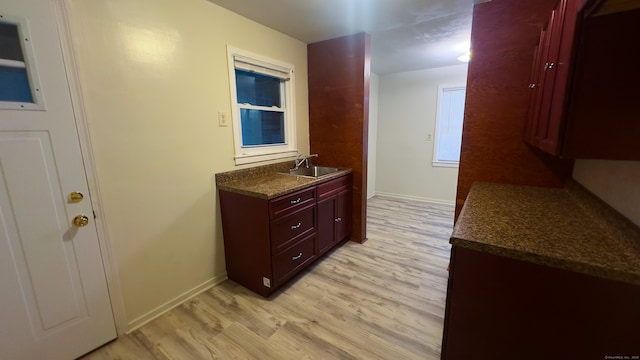 125 Lebanon St, Hartford, CT 06112 - hallway with a sink, light wood-style floors, and baseboards