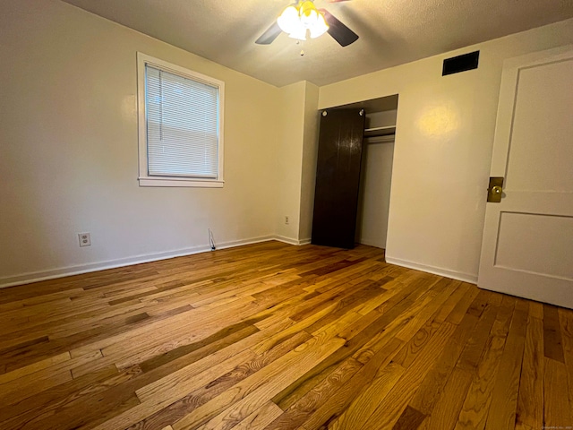 125 Lebanon St, Hartford, CT 06112 - unfurnished bedroom with wood finished floors, a closet, baseboards, and a ceiling fan