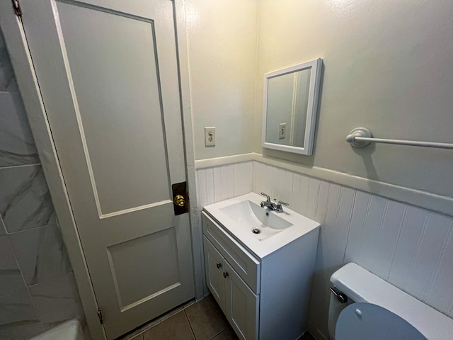 125 Lebanon St, Hartford, CT 06112 - bathroom with toilet, vanity, a wainscoted wall, and a decorative wall