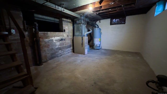 125 Lebanon St, Hartford, CT 06112 - unfinished below grade area with water heater, heating unit, and concrete block wall