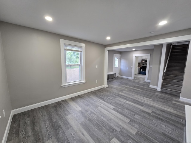 11 Caya Ave, West Hartford, CT 06110 - below grade area featuring stairway, baseboards, recessed lighting, and dark wood-style flooring