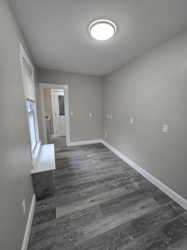 11 Caya Ave, West Hartford, CT 06110 - empty room with baseboards and dark wood-style flooring