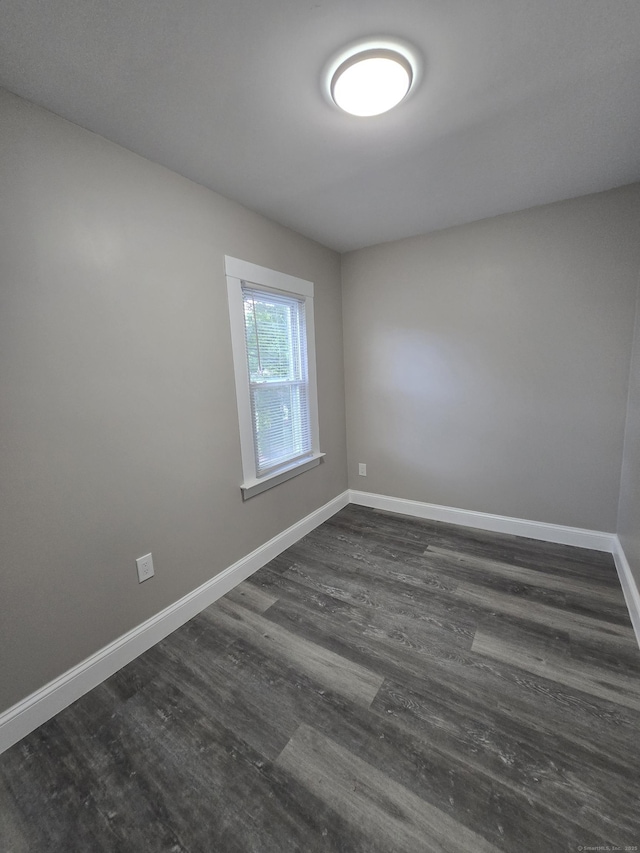 11 Caya Ave, West Hartford, CT 06110 - empty room featuring dark wood-type flooring and baseboards