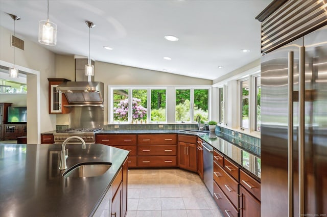 7 Sugar Loaf Cut, Simsbury, CT 06092 - kitchen with premium appliances, a sink, lofted ceiling, wall chimney range hood, and hanging light fixtures