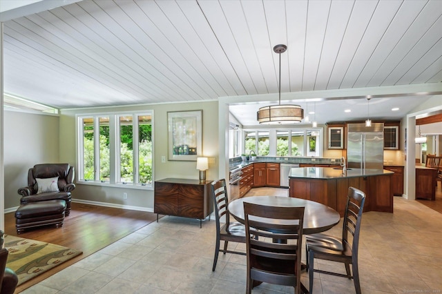 7 Sugar Loaf Cut, Simsbury, CT 06092 - dining room featuring light tile patterned floors, wooden ceiling, and baseboards