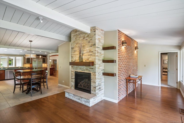 7 Sugar Loaf Cut, Simsbury, CT 06092 - living room featuring wood finished floors, baseboards, and a stone fireplace