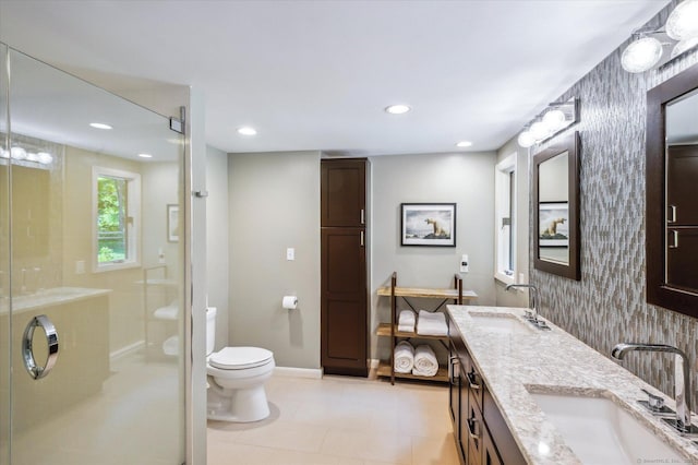 7 Sugar Loaf Cut, Simsbury, CT 06092 - full bathroom with double vanity, wallpapered walls, a stall shower, toilet, and baseboards
