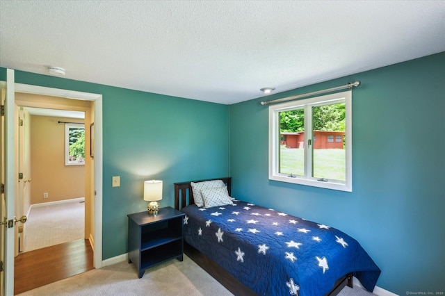 7 Sugar Loaf Cut, Simsbury, CT 06092 - bedroom featuring light carpet, a textured ceiling, and baseboards