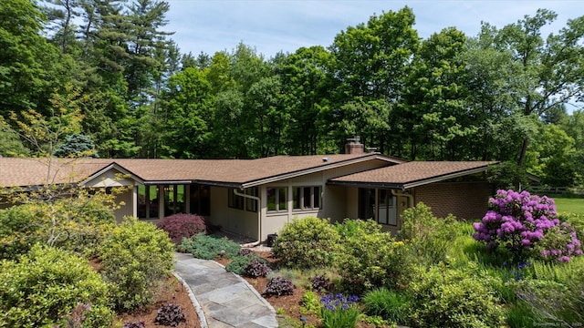 7 Sugar Loaf Cut, Simsbury, CT 06092 - view of front of home featuring a chimney and roof with shingles