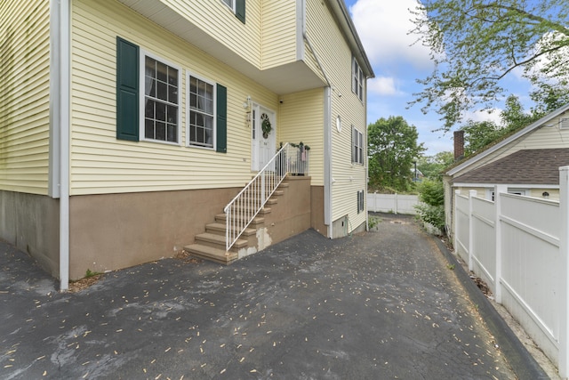 1095 Hope St Unit B, Stamford, CT 06907 - view of property exterior featuring fence and a patio