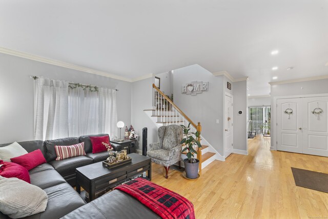 1095 Hope St Unit B, Stamford, CT 06907 - living area featuring stairway, crown molding, light wood-type flooring, and baseboards