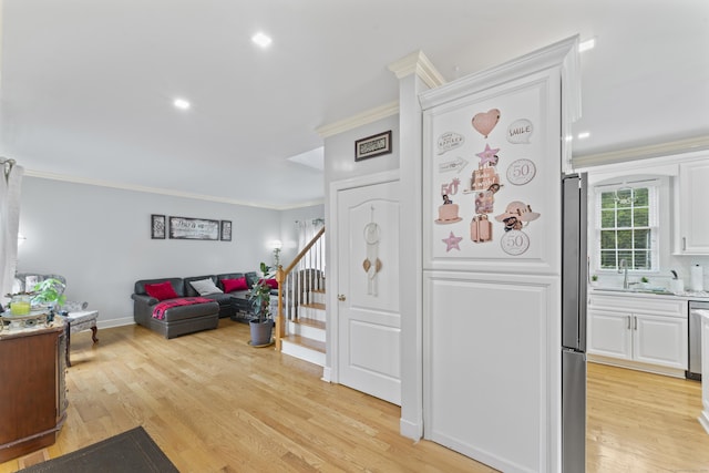 1095 Hope St Unit B, Stamford, CT 06907 - entrance foyer with crown molding, stairway, light wood-type flooring, and recessed lighting