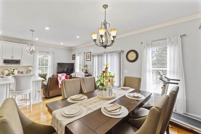 1095 Hope St Unit B, Stamford, CT 06907 - dining area with a chandelier, crown molding, light wood-style floors, and recessed lighting