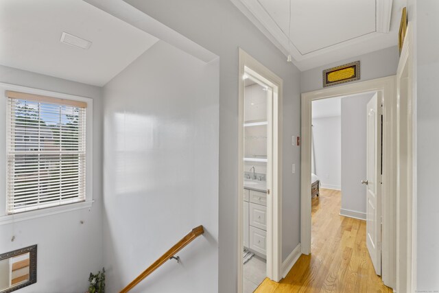 1095 Hope St Unit B, Stamford, CT 06907 - hallway with attic access, light wood-style flooring, a sink, baseboards, and lofted ceiling