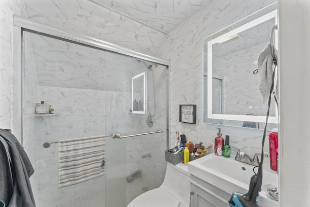 1095 Hope St Unit B, Stamford, CT 06907 - bathroom featuring a shower stall, vanity, tile walls, and toilet