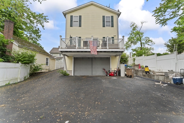 1095 Hope St Unit B, Stamford, CT 06907 - rear view of property featuring fence and a garage