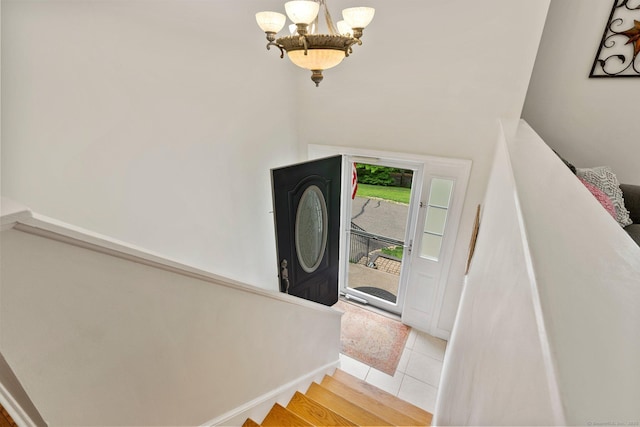 114 Ives Ave, Meriden, CT 06450 - foyer entrance with a chandelier, light tile patterned flooring, and baseboards