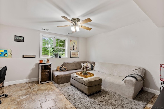 114 Ives Ave, Meriden, CT 06450 - living area with wine cooler, baseboards, ceiling fan, and stone finish floors