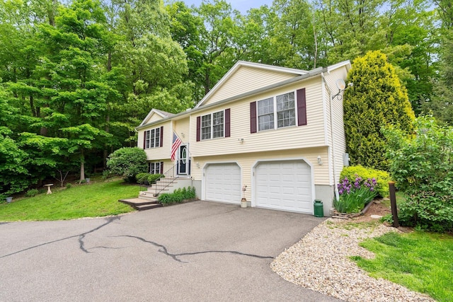 114 Ives Ave, Meriden, CT 06450 - raised ranch featuring driveway and a garage