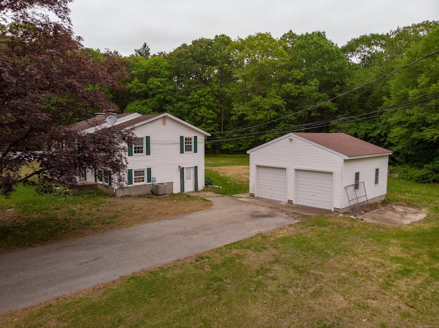 29 Ralph St, Plainfield, CT 06354 - detached garage featuring a forest view