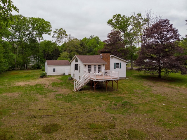 29 Ralph St, Plainfield, CT 06354 - rear view of property featuring a deck, a yard, a chimney, and stairway