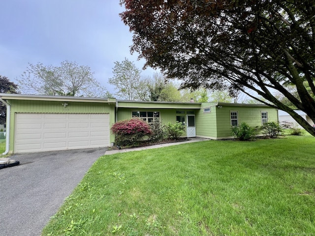 265 Marina Dr, Stratford, CT 06614 - view of front of property with an attached garage, driveway, and a front yard