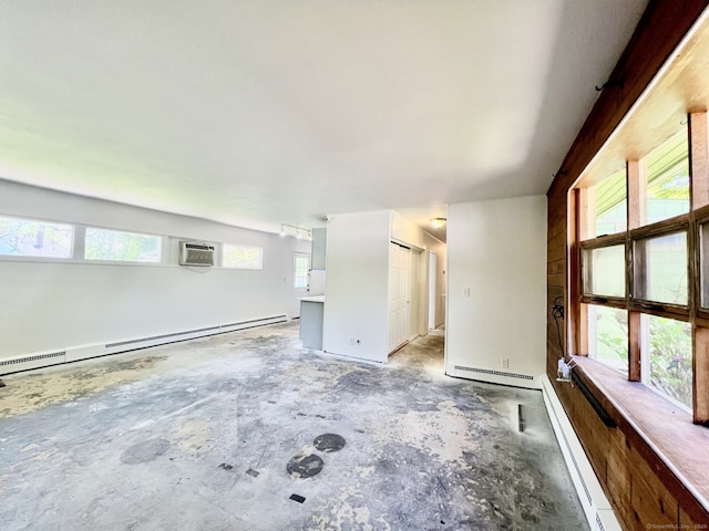 265 Marina Dr, Stratford, CT 06614 - unfurnished living room featuring a baseboard heating unit, concrete floors, and an AC wall unit