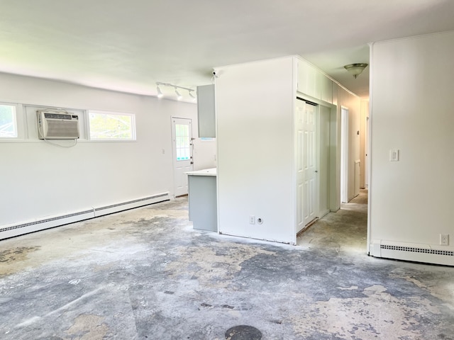 265 Marina Dr, Stratford, CT 06614 - empty room with a baseboard heating unit, concrete flooring, and a wall mounted AC