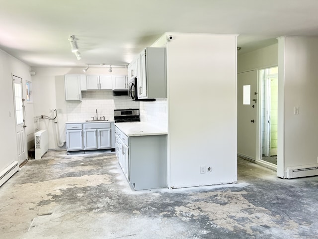 265 Marina Dr, Stratford, CT 06614 - kitchen with a sink, tasteful backsplash, light countertops, a baseboard radiator, and stainless steel range with electric cooktop