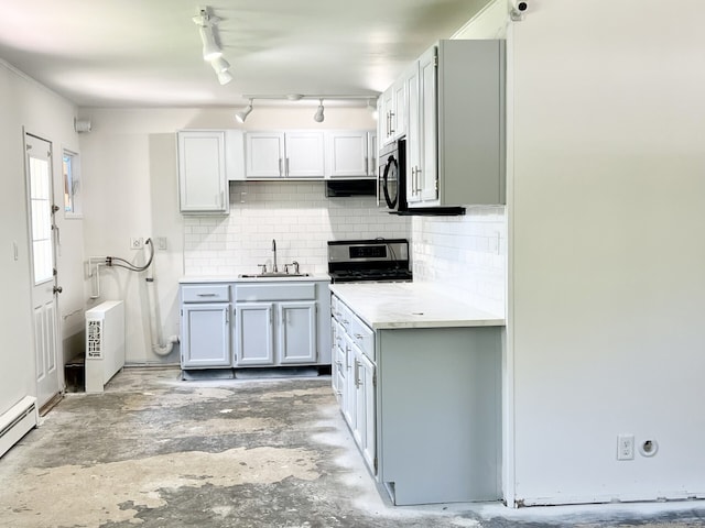 265 Marina Dr, Stratford, CT 06614 - kitchen featuring a sink, unfinished concrete flooring, a baseboard radiator, backsplash, and light countertops