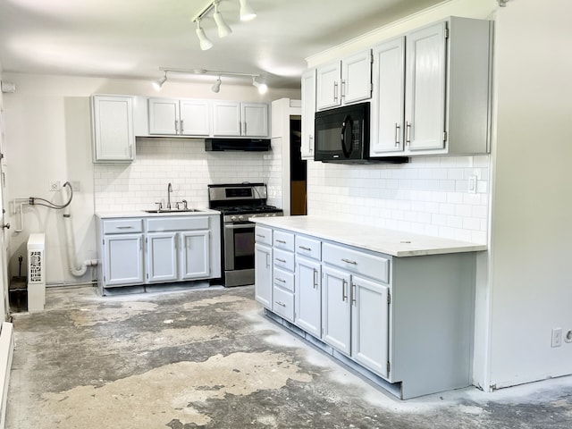 265 Marina Dr, Stratford, CT 06614 - kitchen featuring stainless steel gas range oven, a sink, black microwave, exhaust hood, and concrete floors